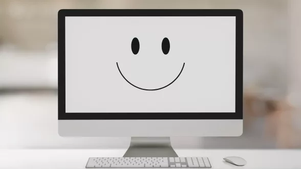 a picture of a computer screen with a happy face on it to signify a good user experience